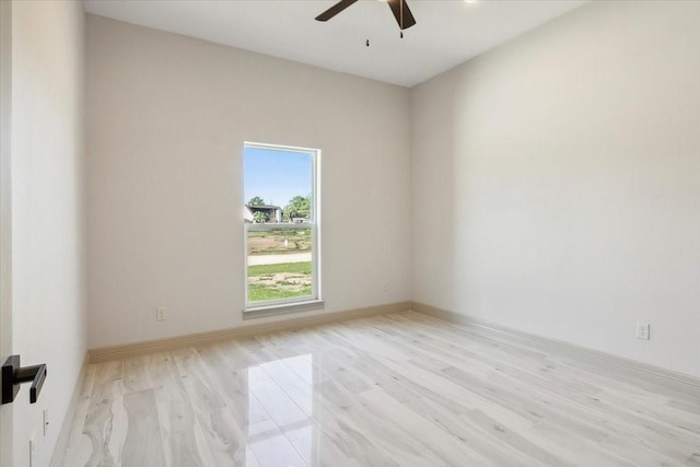 unfurnished room with light wood-type flooring and ceiling fan