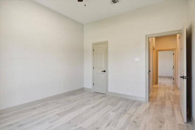 unfurnished bedroom featuring light wood-type flooring