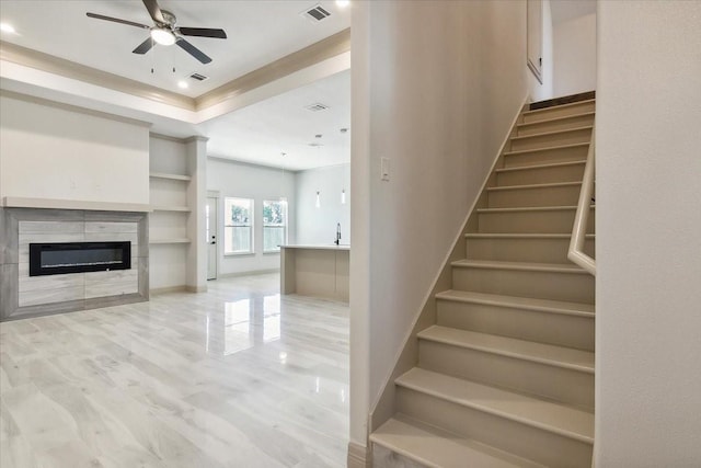 stairway featuring hardwood / wood-style floors and ceiling fan