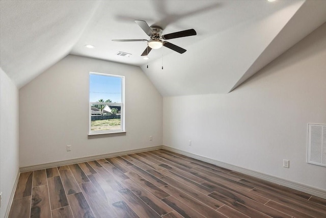 additional living space featuring lofted ceiling, ceiling fan, and dark hardwood / wood-style floors