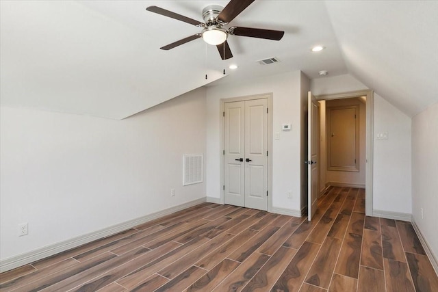 bonus room featuring dark hardwood / wood-style floors, ceiling fan, and lofted ceiling