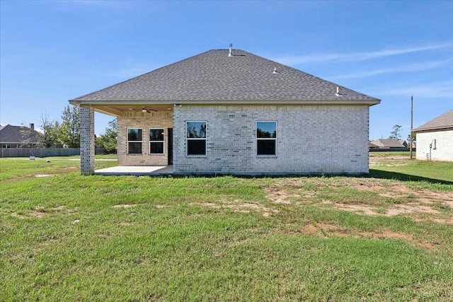 back of house featuring a yard, a patio, and ceiling fan