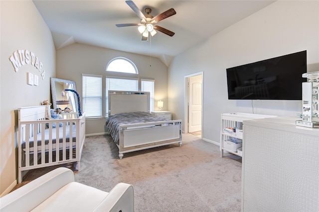 bedroom with ceiling fan, light colored carpet, and lofted ceiling