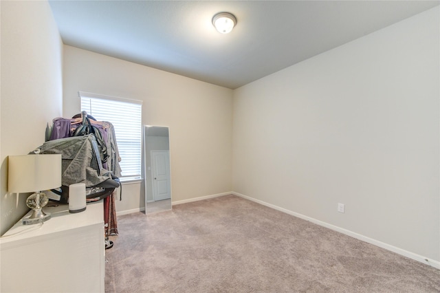 interior space featuring light colored carpet