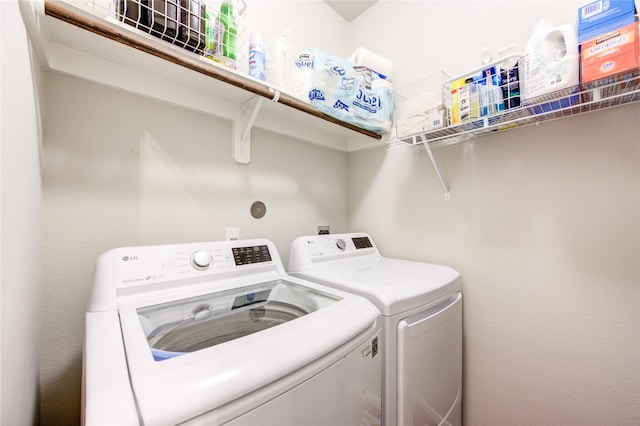 laundry room featuring washing machine and clothes dryer