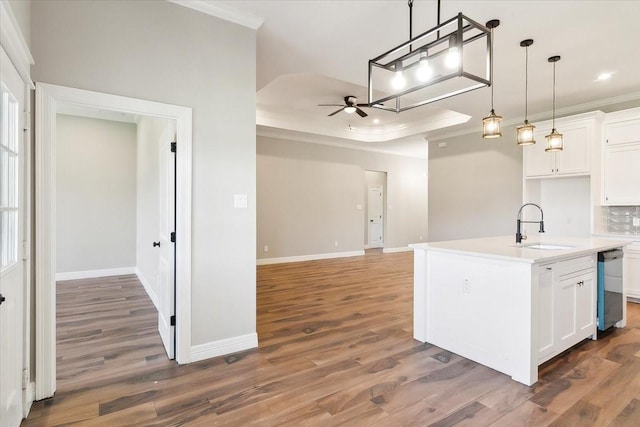 kitchen featuring white cabinetry, sink, dark wood-type flooring, stainless steel dishwasher, and a kitchen island with sink