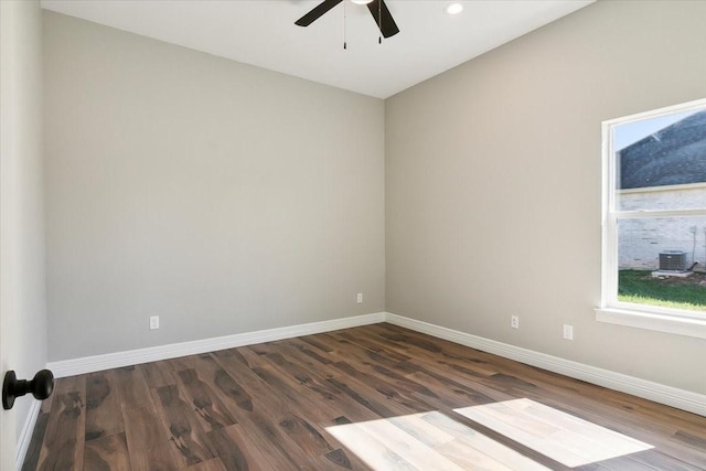 unfurnished room featuring ceiling fan and dark hardwood / wood-style floors