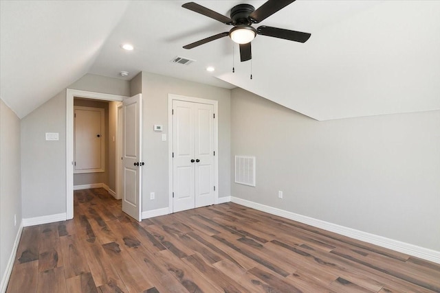 bonus room featuring dark hardwood / wood-style floors, ceiling fan, and vaulted ceiling
