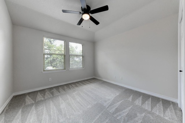 unfurnished room featuring carpet, ceiling fan, and lofted ceiling