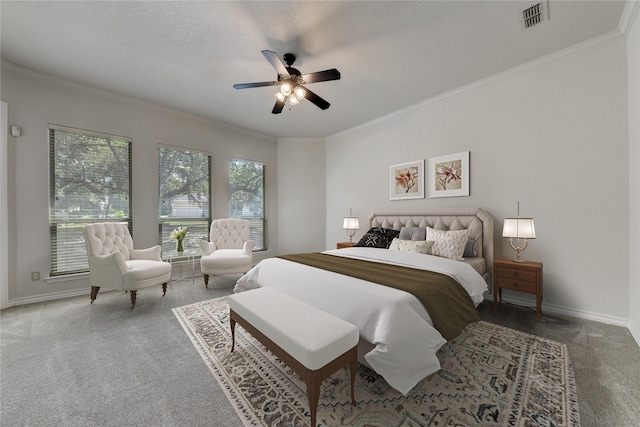 carpeted bedroom with a textured ceiling, ceiling fan, and ornamental molding