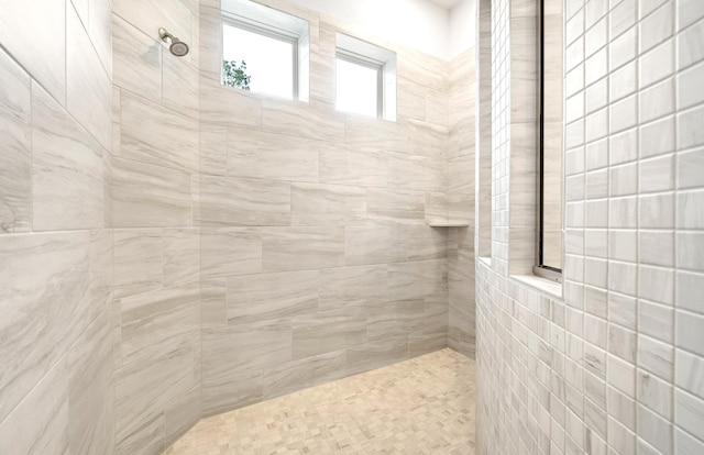 bathroom with tiled shower