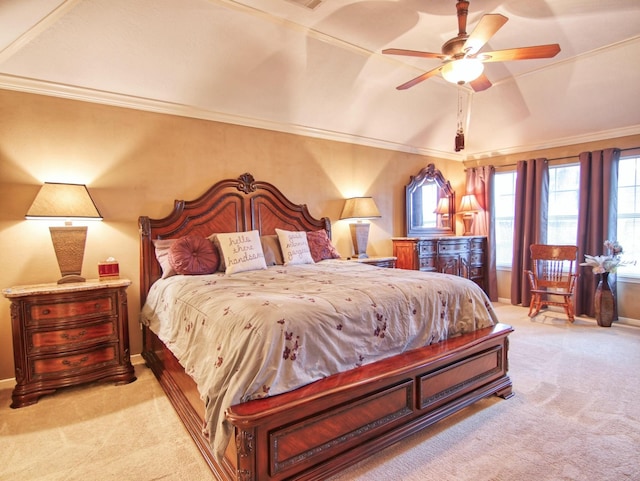 bedroom with ceiling fan, light colored carpet, lofted ceiling, and ornamental molding