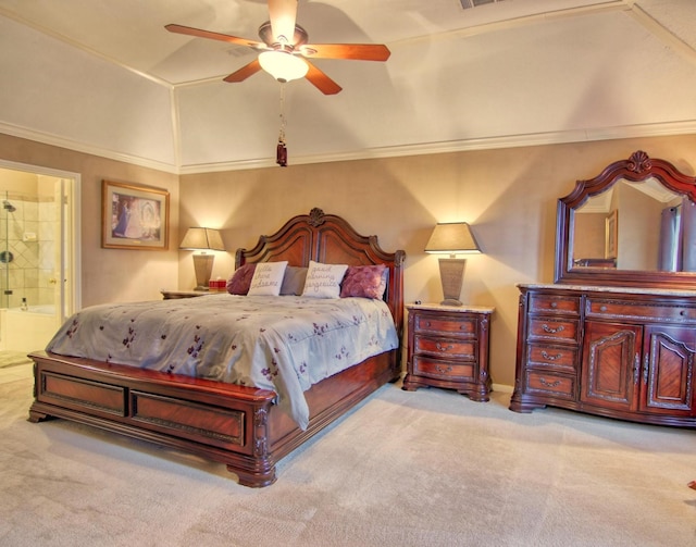 carpeted bedroom featuring ensuite bathroom, vaulted ceiling, ceiling fan, and ornamental molding