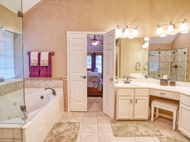 bathroom featuring vanity, tile patterned floors, ceiling fan, and lofted ceiling