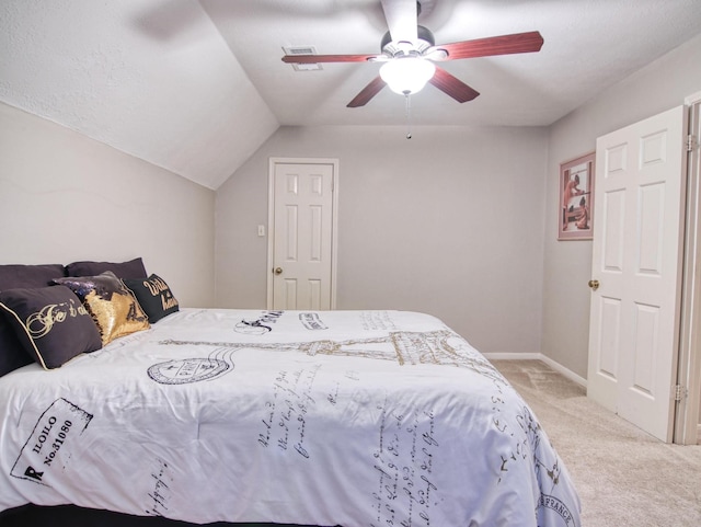 carpeted bedroom featuring ceiling fan and lofted ceiling