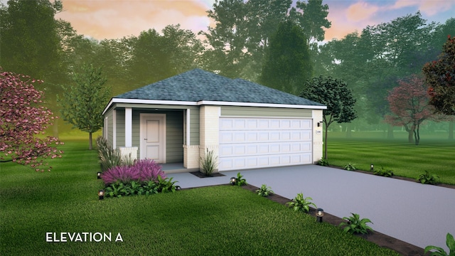 garage at dusk featuring a lawn