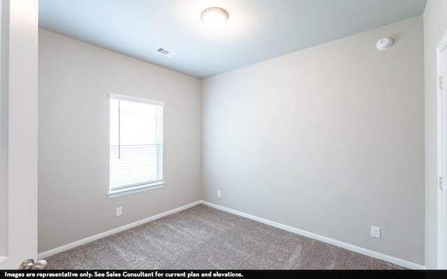 empty room featuring carpet flooring