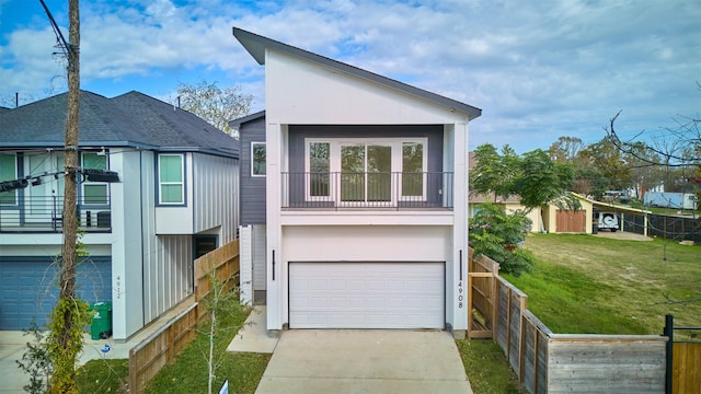 exterior space featuring a balcony and a garage