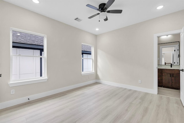 unfurnished room featuring ceiling fan and light hardwood / wood-style floors