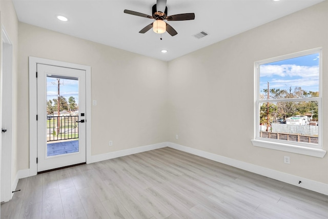 unfurnished room featuring ceiling fan and light wood-type flooring