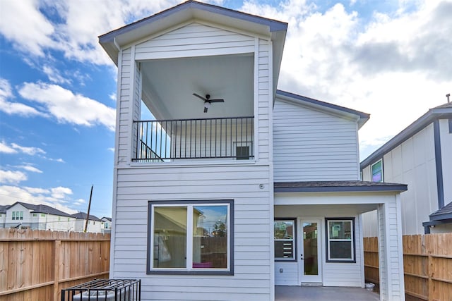 back of house with a patio