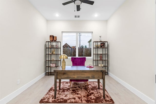 office space with light hardwood / wood-style flooring and ceiling fan