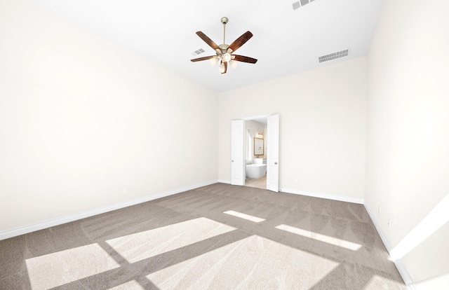 unfurnished room with carpet and ceiling fan