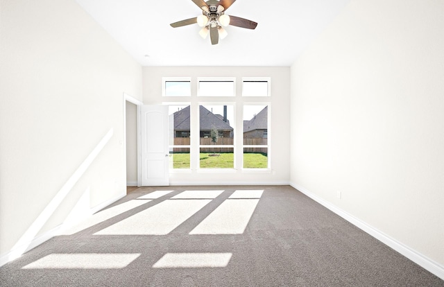 unfurnished room featuring carpet floors and ceiling fan