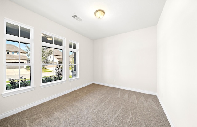 empty room with carpet flooring