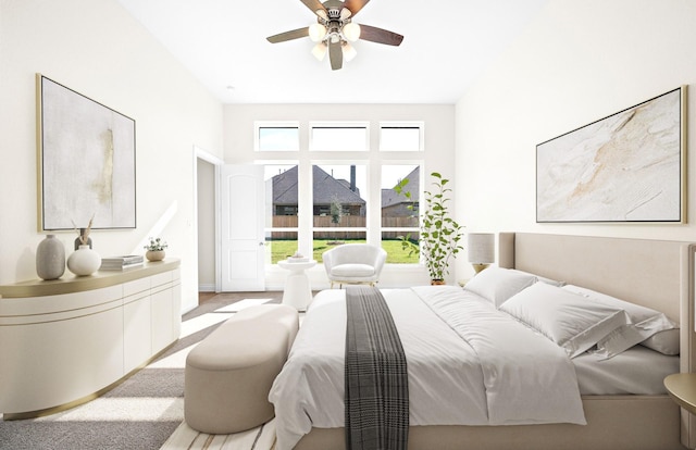 bedroom with ceiling fan and light carpet