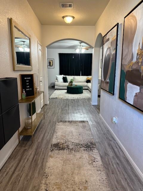 hallway featuring dark hardwood / wood-style flooring