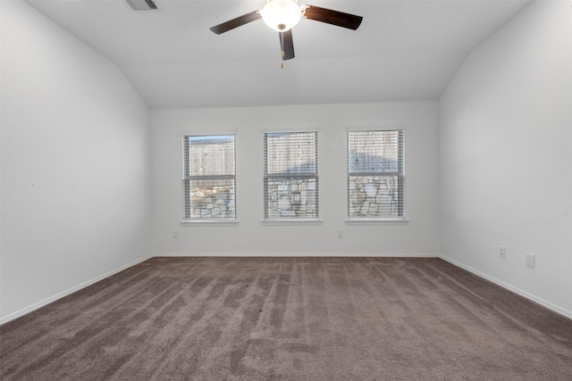 12305 Delta Timber Rd, Conroe, TX 77304 - unfurnished room featuring lofted ceiling, healthy amount of natural light, a ceiling fan, and dark carpet