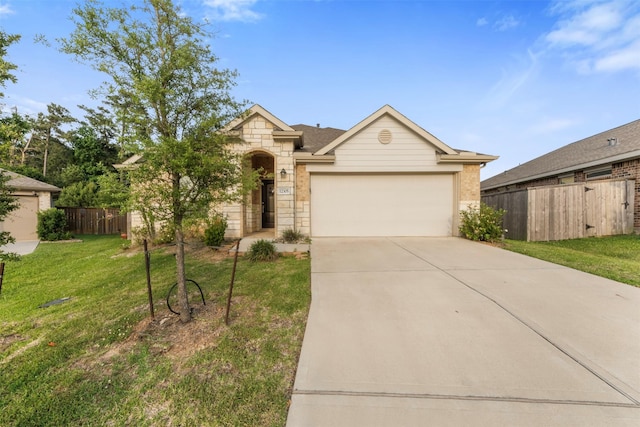 12305 Delta Timber Rd, Conroe, TX 77304 - view of front of house with driveway, a garage, and stone siding