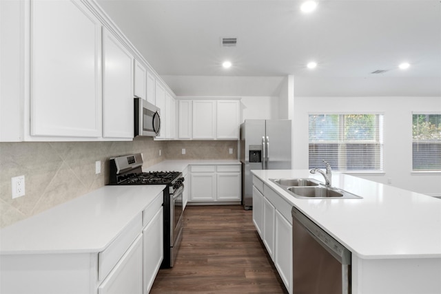 12305 Delta Timber Rd, Conroe, TX 77304 - kitchen featuring appliances with stainless steel finishes, a sink, white cabinets, a center island with sink, and recessed lighting