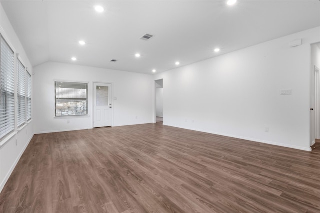 12305 Delta Timber Rd, Conroe, TX 77304 - unfurnished living room featuring recessed lighting, dark wood-style flooring, baseboards, and vaulted ceiling