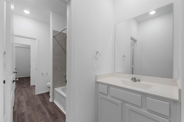12305 Delta Timber Rd, Conroe, TX 77304 - bathroom with toilet, wood finished floors, vanity, shower / bathtub combination, and recessed lighting