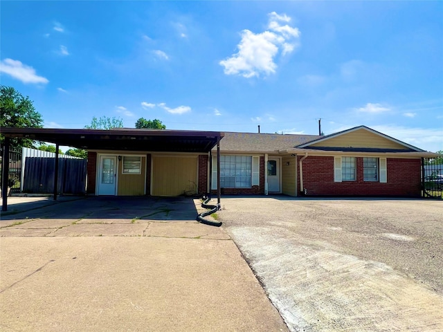 ranch-style house featuring a carport