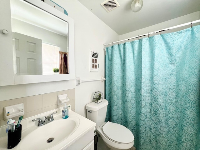 bathroom with a shower with shower curtain, vanity, toilet, and backsplash