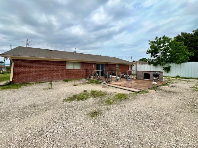 rear view of house with a deck