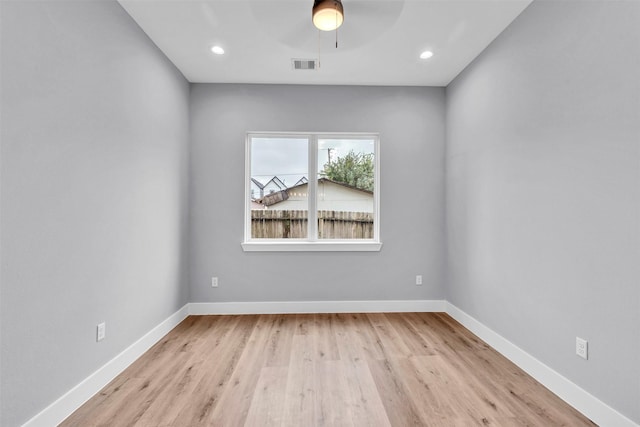 spare room featuring ceiling fan and light hardwood / wood-style floors