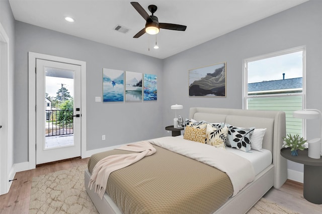 bedroom with access to exterior, ceiling fan, and light hardwood / wood-style floors