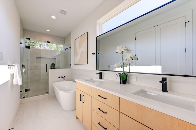 bathroom featuring tile patterned flooring, vanity, and independent shower and bath