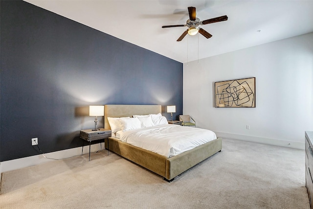 bedroom featuring ceiling fan and light colored carpet