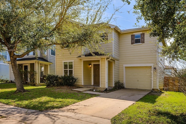 view of front of house with a front yard and a garage