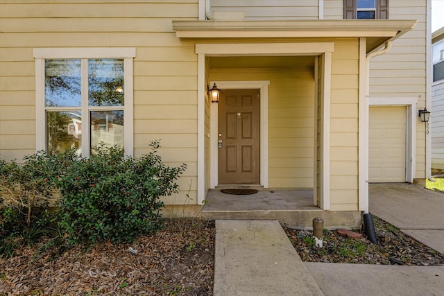 view of exterior entry featuring a garage