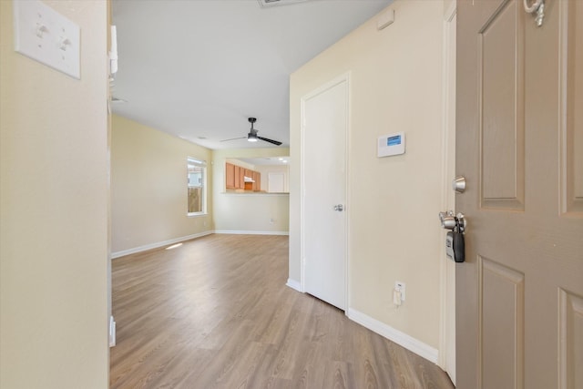 entryway with ceiling fan and light hardwood / wood-style floors