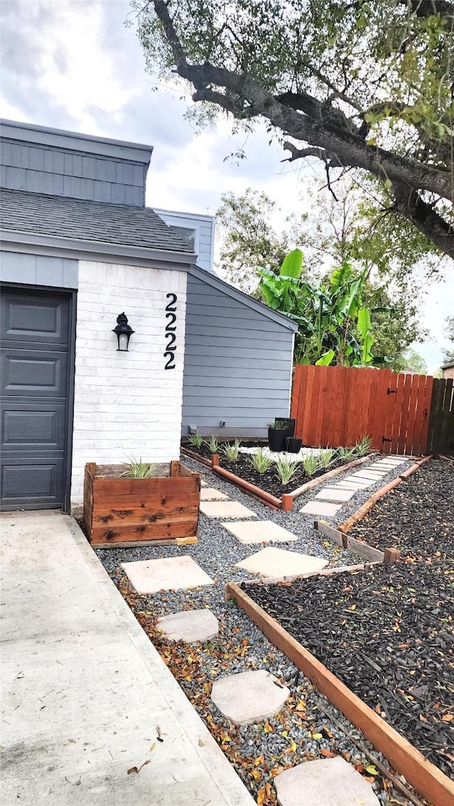 view of exterior entry featuring a garage