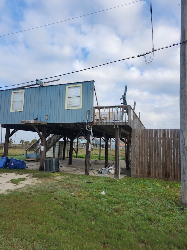 view of dock with a lawn