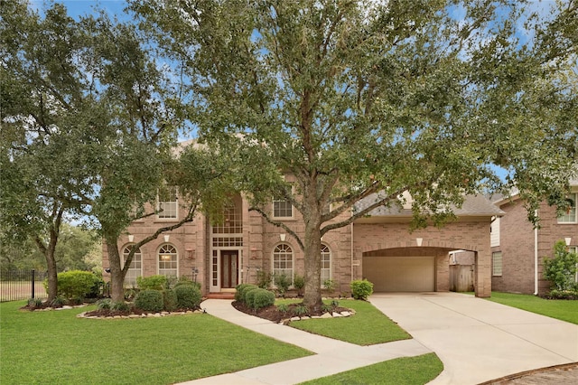 view of front facade with a front lawn and a garage