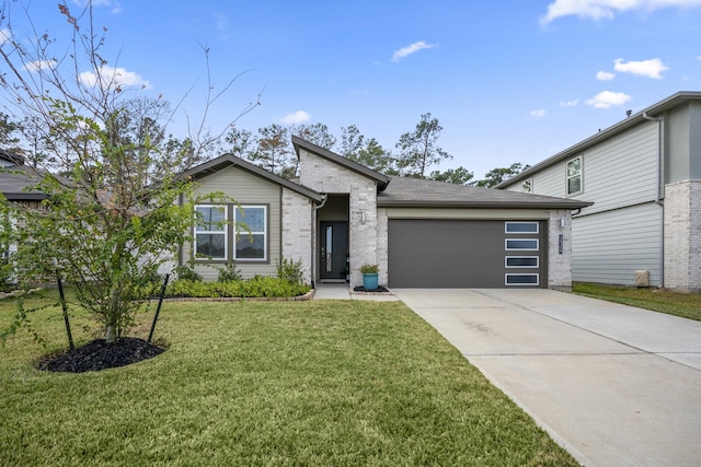 view of front of home with a front lawn and a garage